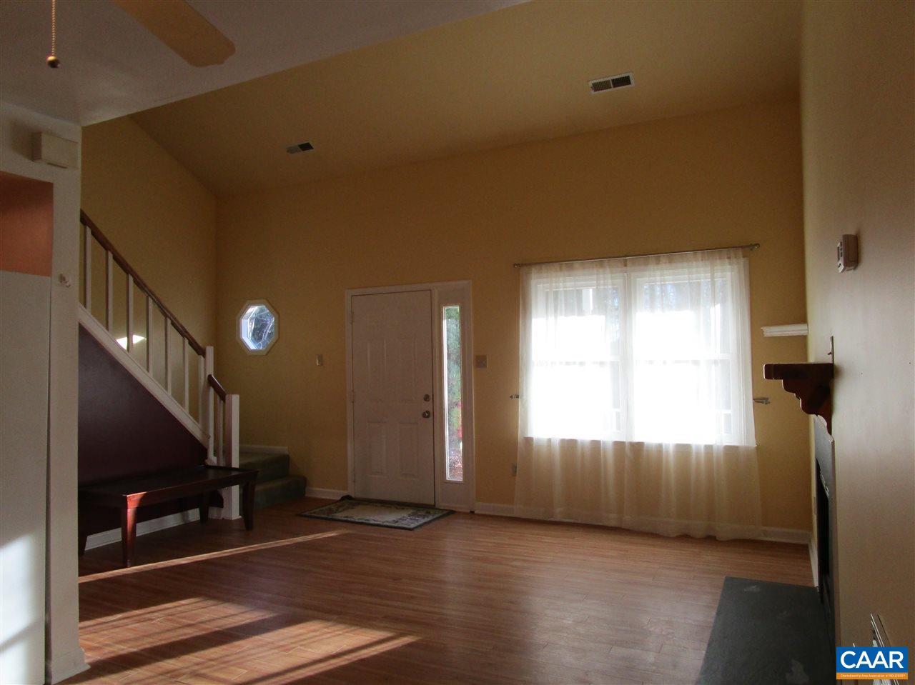 699 Carnation Road Ruckersville, VA 22968 - Photo 22 of 40 a view of an empty room with wooden floor and a window