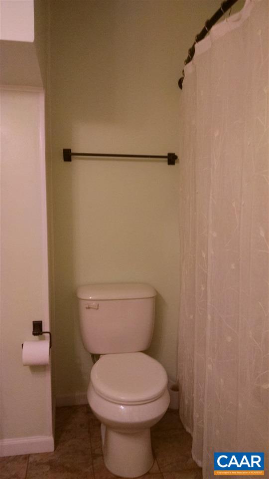 699 Carnation Road Ruckersville, VA 22968 - Photo 26 of 40 a white toilet sitting next to a shower