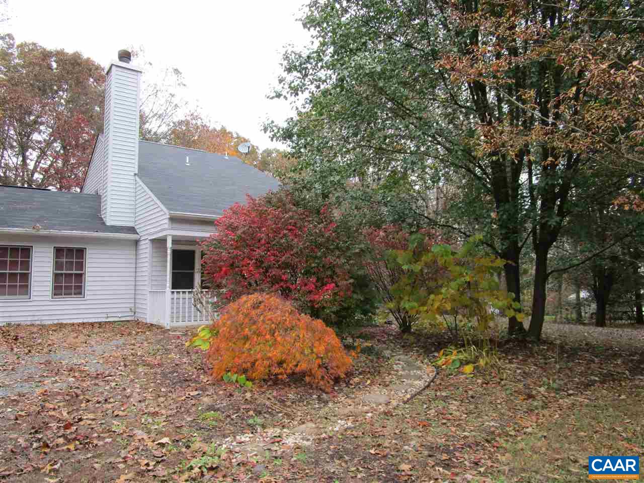 699 Carnation Road Ruckersville, VA 22968 - Photo 3 of 40 a backyard of a house with plants and large tree