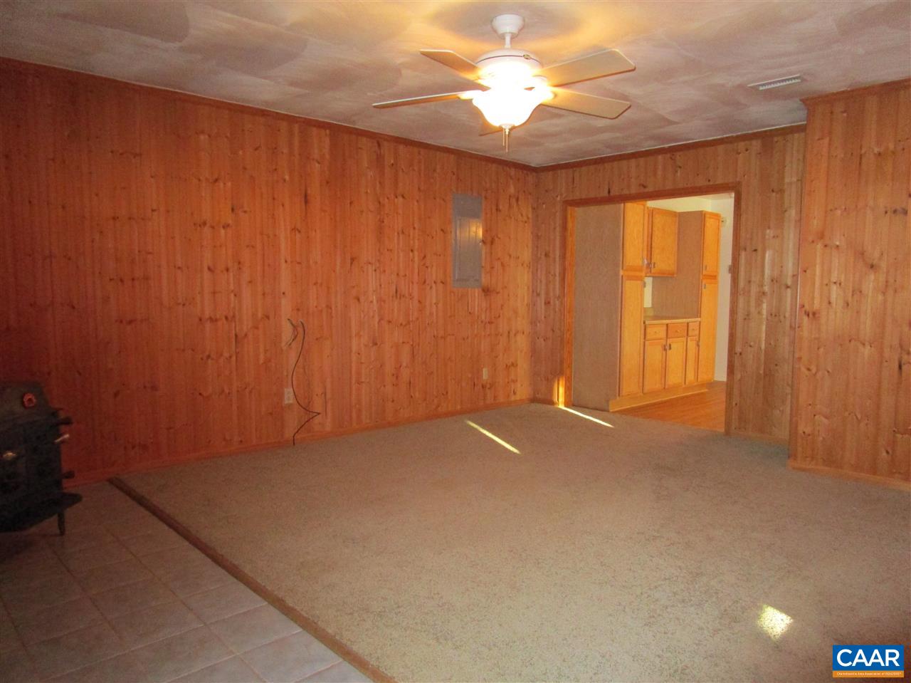 699 Carnation Road Ruckersville, VA 22968 - Photo 8 of 40 an empty room with a windows and a ceiling fan