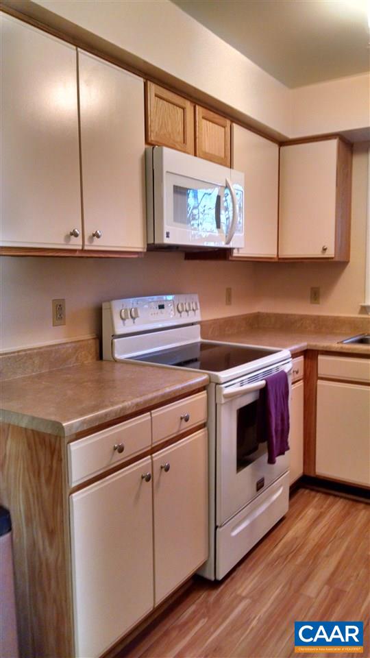 699 Carnation Road Ruckersville, VA 22968 - Photo 10 of 40 a kitchen with stainless steel appliances granite countertop a sink a stove and a microwave