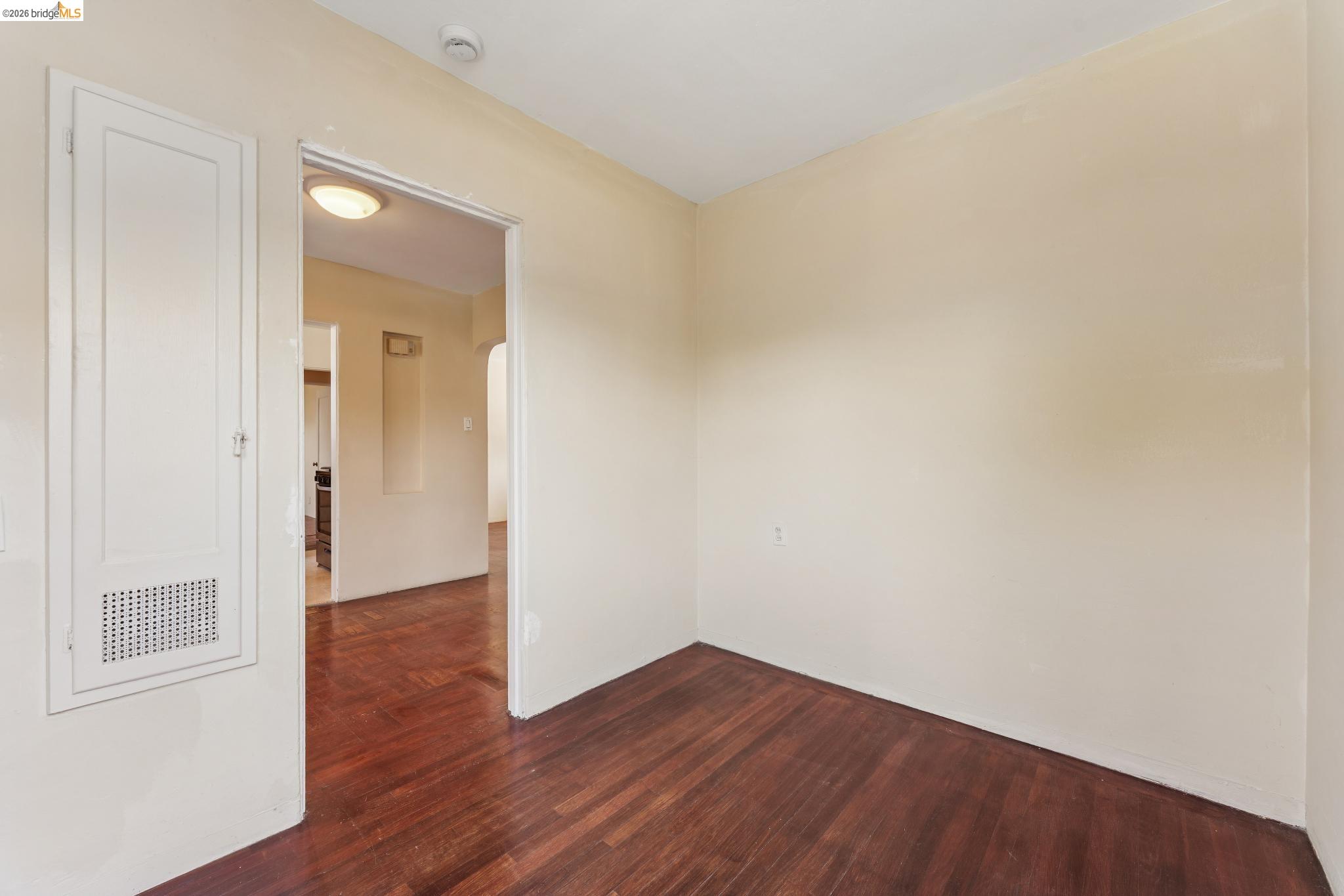 2879 Rheem Avenue Richmond, CA 94804 - Photo 17 of 45 Room featuring dark wood-finish flooring and light-toned walls