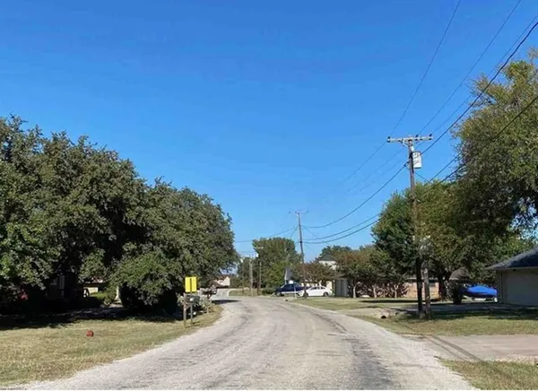 a view of road with trees