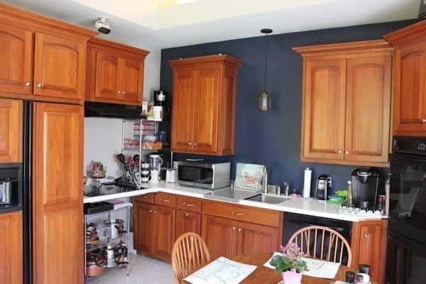 64 Fiskdale Road Brookfield, MA 01506 - Photo 26 of 42 a kitchen with stainless steel appliances granite countertop wooden cabinets a sink and dishwasher