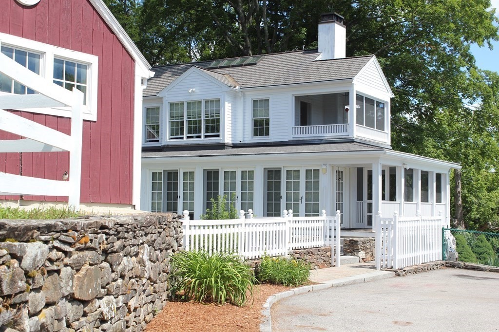 64 Fiskdale Road Brookfield, MA 01506 - Photo 4 of 42 a front view of a house with a garden