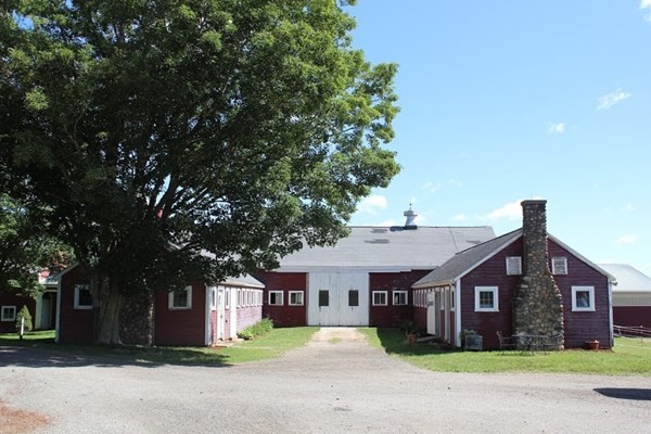 64 Fiskdale Road Brookfield, MA 01506 - Photo 41 of 42 a front view of a house with a garden