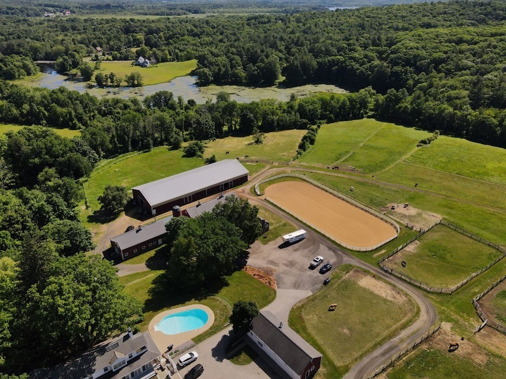 64 Fiskdale Road Brookfield, MA 01506 - Photo 7 of 42 an aerial view of a backyard and swimming pool