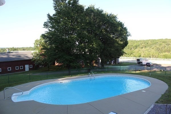 64 Fiskdale Road Brookfield, MA 01506 - Photo 9 of 42 a view of a swimming pool with a yard