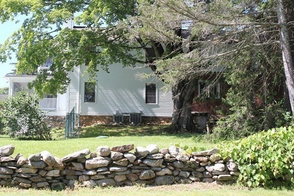 64 Fiskdale Road Brookfield, MA 01506 - Photo 10 of 42 a view of a house with a yard and garden