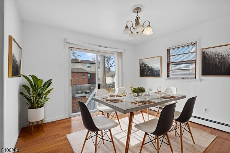 44 Liberty Street Clifton, NJ 07013 - Photo 2 of 11 a view of a dining room with furniture and wooden floor