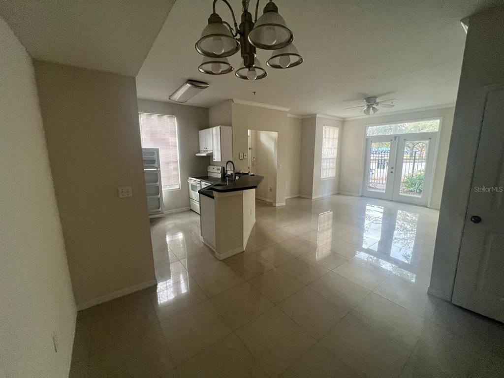 6368 Raleigh Street, Unit 1803 Orlando, FL 32835 - Photo 7 of 14 a view of a dining room with furniture window and wooden floor
