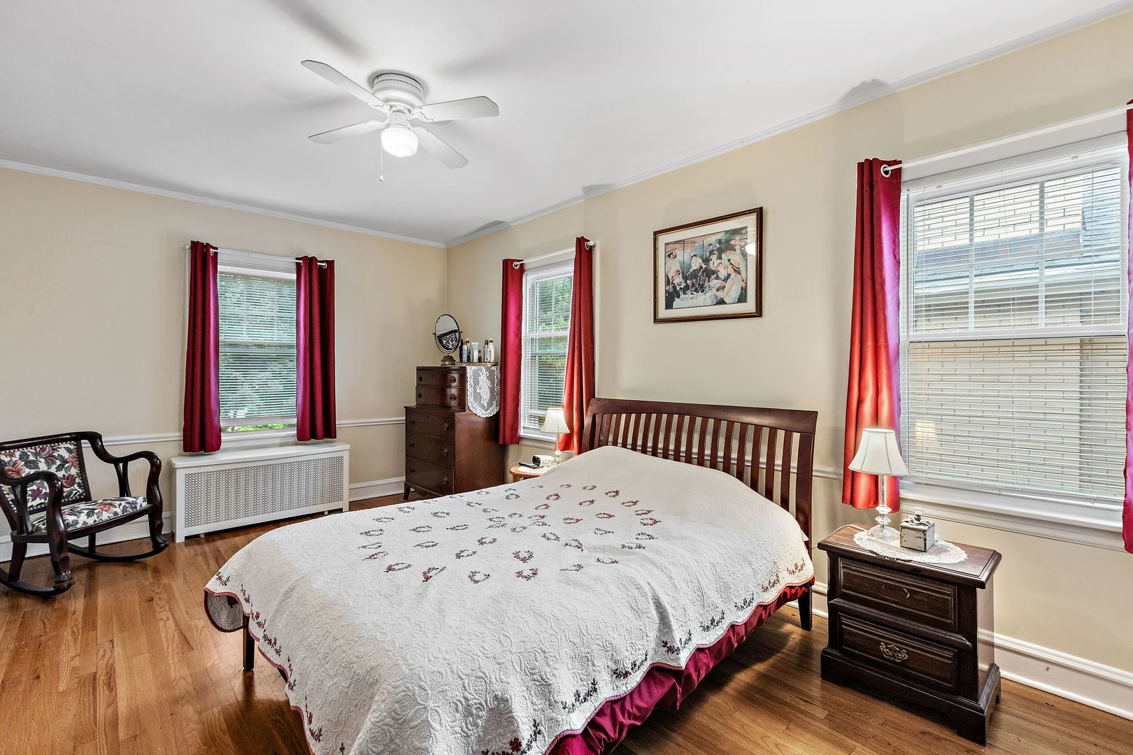 379 Blythe Road Riverside, IL 60546 - Photo 14 of 27 a bedroom with bed and a large window with wooden floor