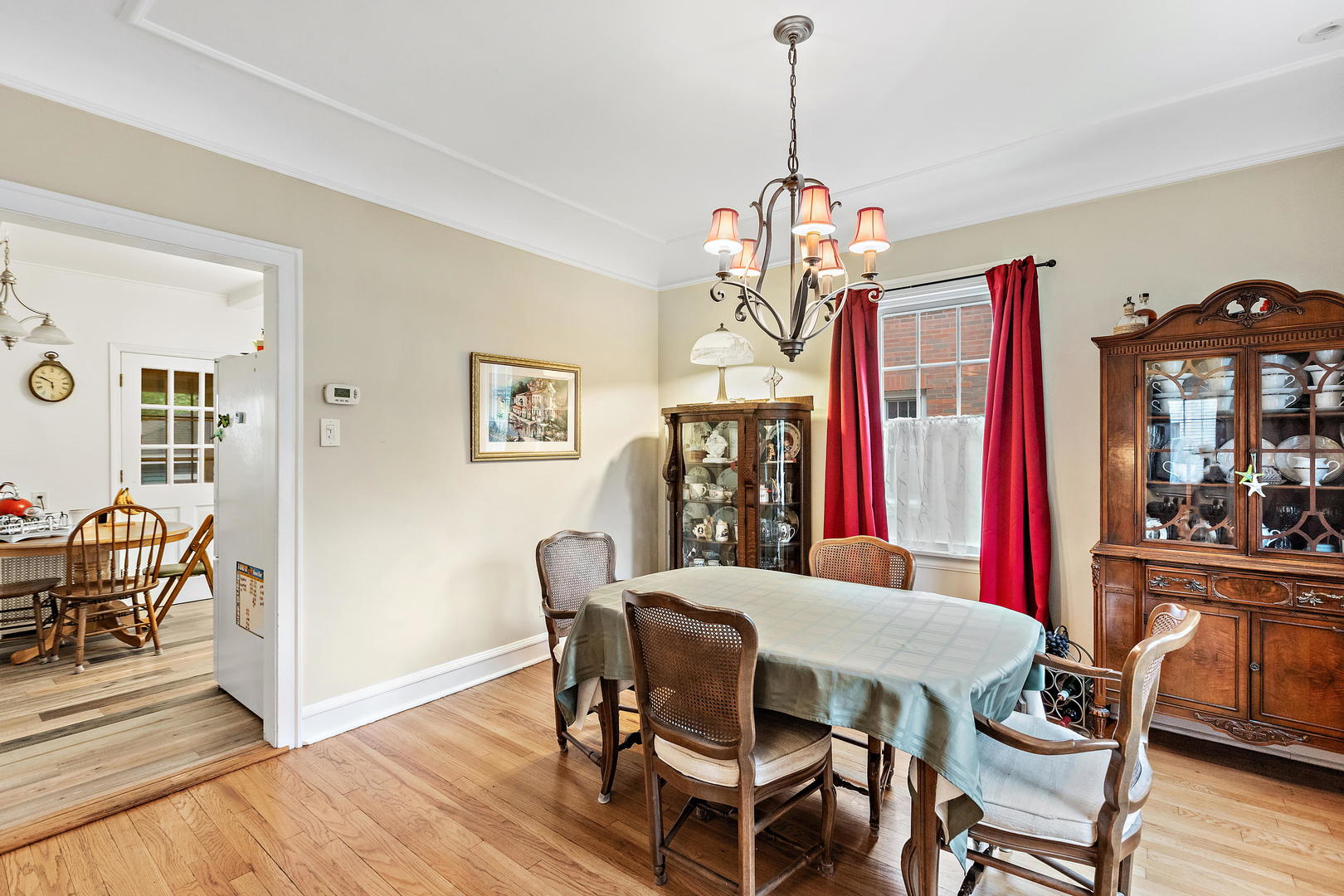 379 Blythe Road Riverside, IL 60546 - Photo 10 of 27 a view of a dining room with furniture wooden floor and chandelier