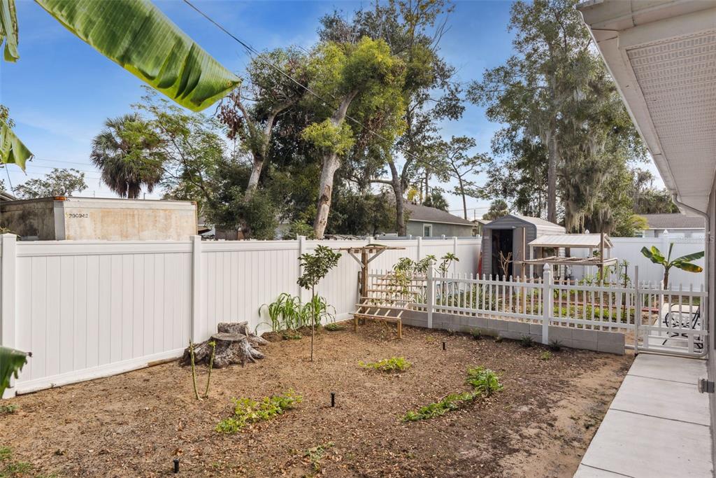 1021 Titcomb Street Eustis, FL 32726 - Photo 15 of 40 a view of a house with a wooden fence