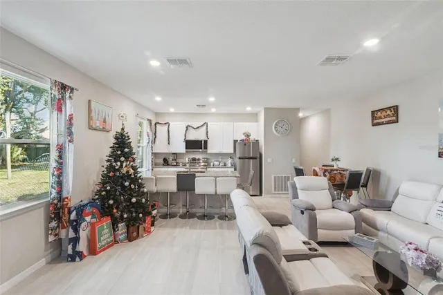 a living room with furniture and a large window
