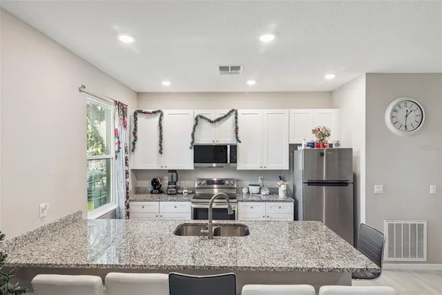 a view of a chairs and table on the balcony