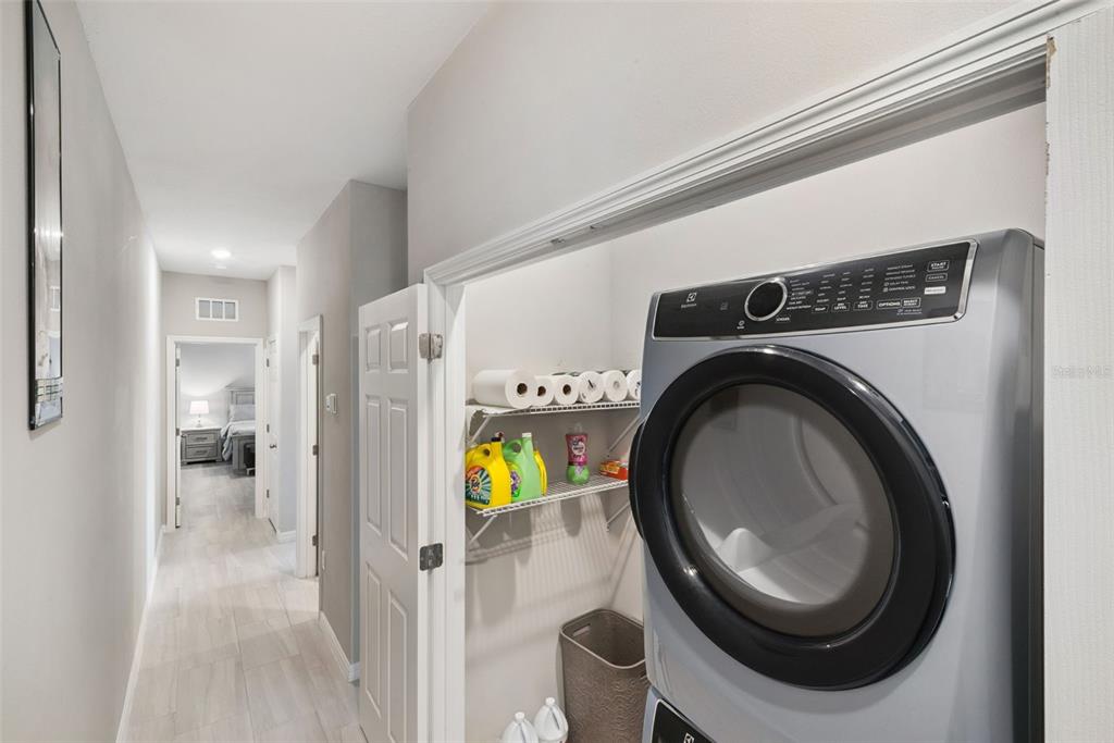 1021 Titcomb Street Eustis, FL 32726 - Photo 32 of 40 a view of a hallway with washer and dryer