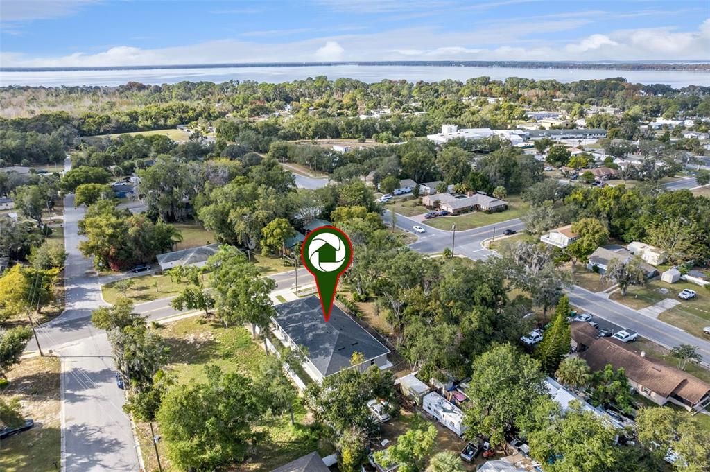 1021 Titcomb Street Eustis, FL 32726 - Photo 39 of 40 an aerial view of a house with a yard