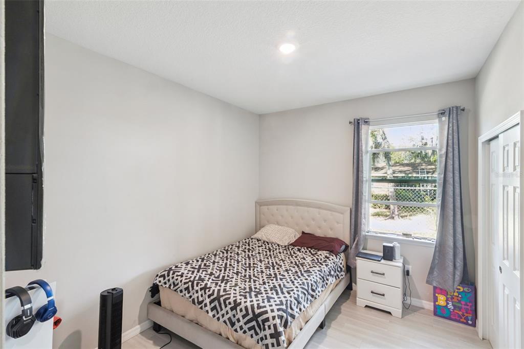 1021 Titcomb Street Eustis, FL 32726 - Photo 10 of 40 a bedroom with a bed and a window