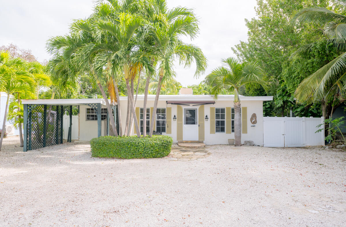 front view of a house with a garden