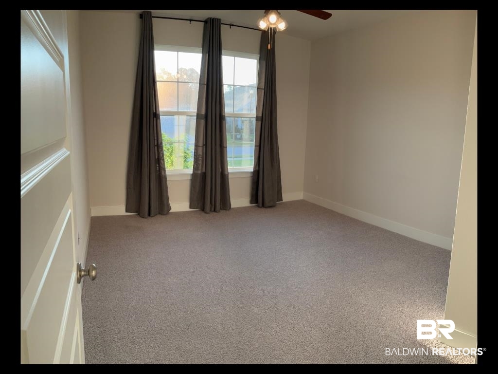 1093 Pheasant Circle Foley, AL 36535 - Photo 15 of 25 Spare room with light carpet and ceiling fan