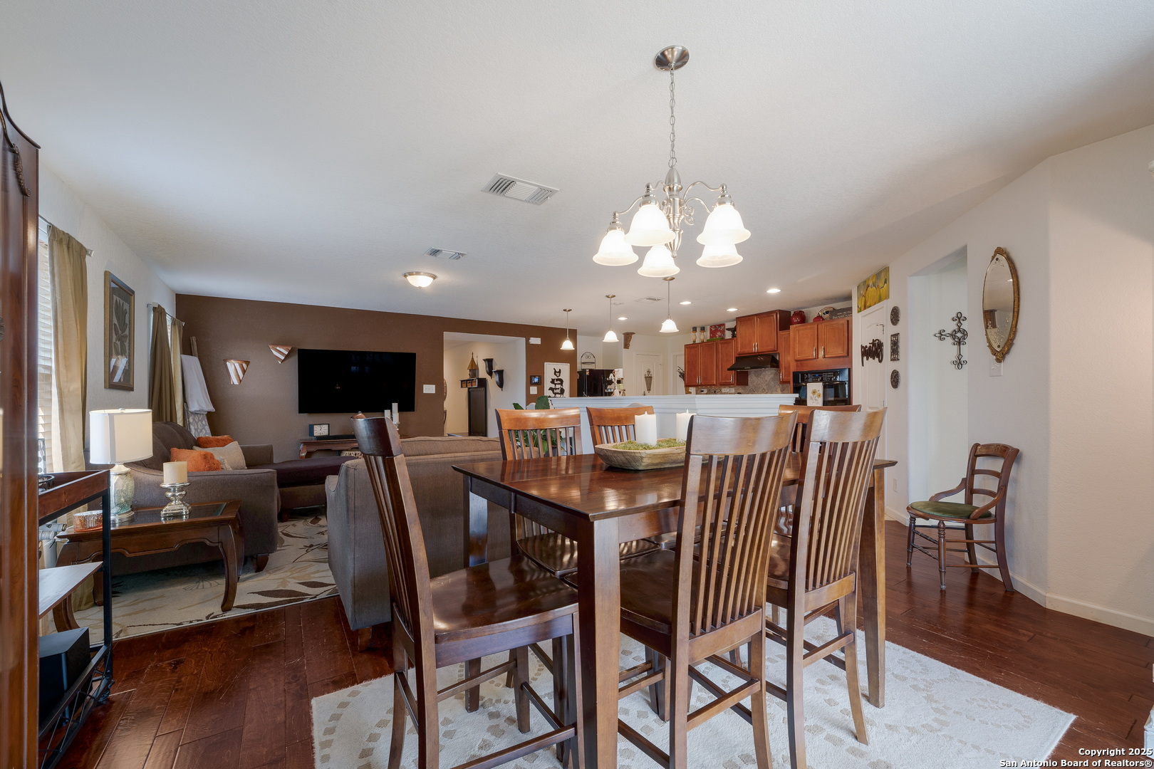 6226 Fred Couples Schertz, TX 78108 - Photo 12 of 30 a view of a dining room with furniture and wooden floor