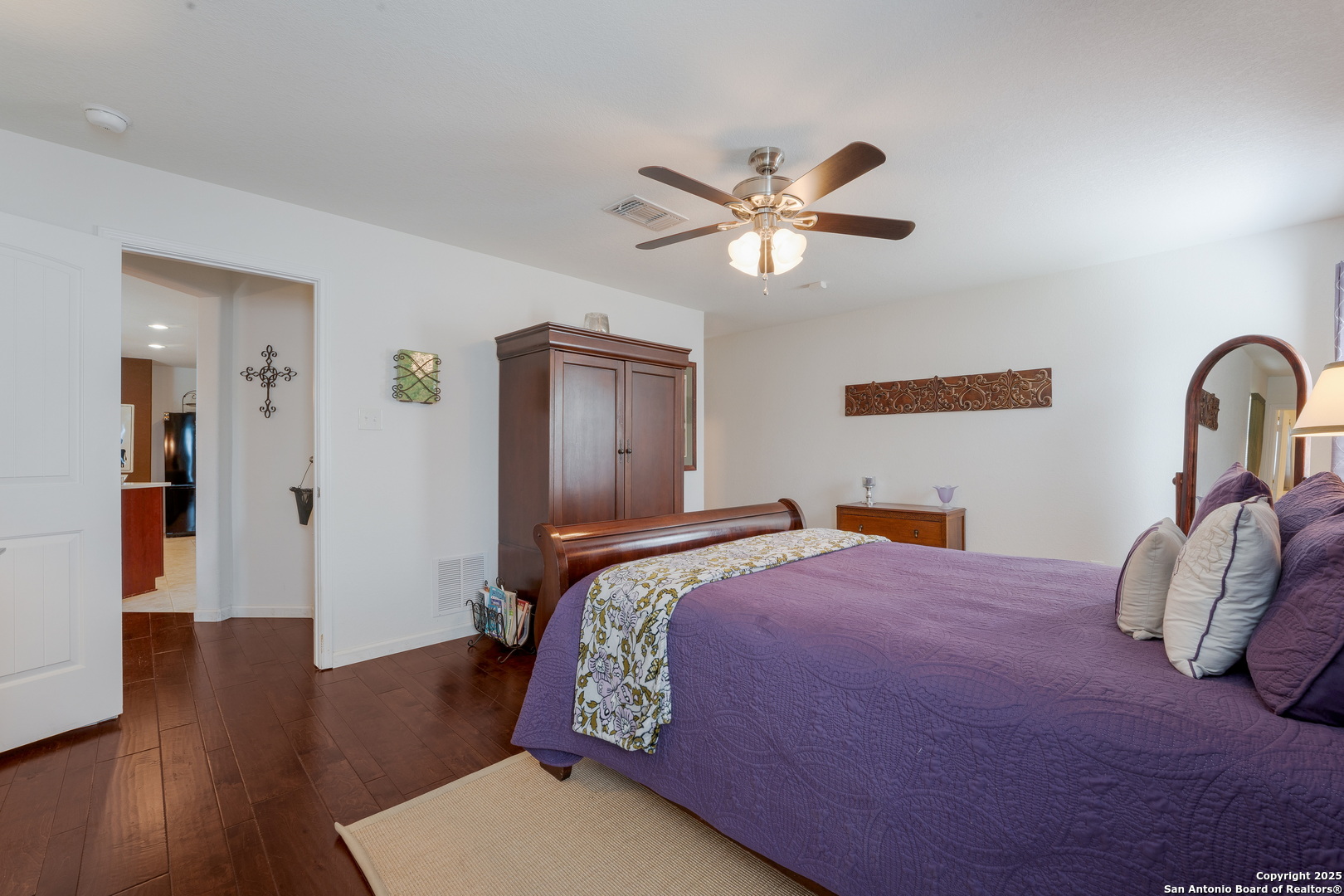 6226 Fred Couples Schertz, TX 78108 - Photo 16 of 30 a bedroom with a bed and a chandelier