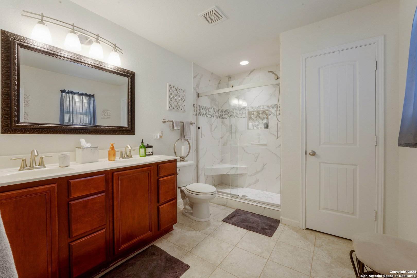 6226 Fred Couples Schertz, TX 78108 - Photo 20 of 30 a bathroom with a double vanity sink mirror double shower and a bathtub