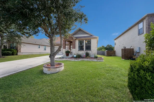 a front view of house with yard and outdoor seating