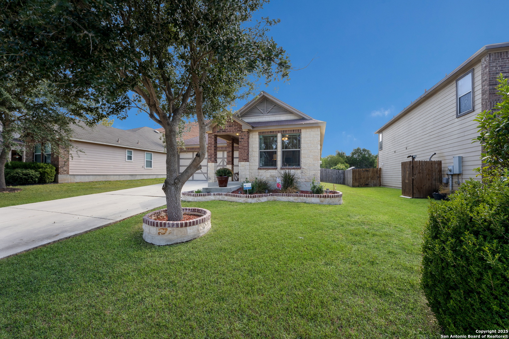 6226 Fred Couples Schertz, TX 78108 - Photo 2 of 30 a front view of house with yard and outdoor seating