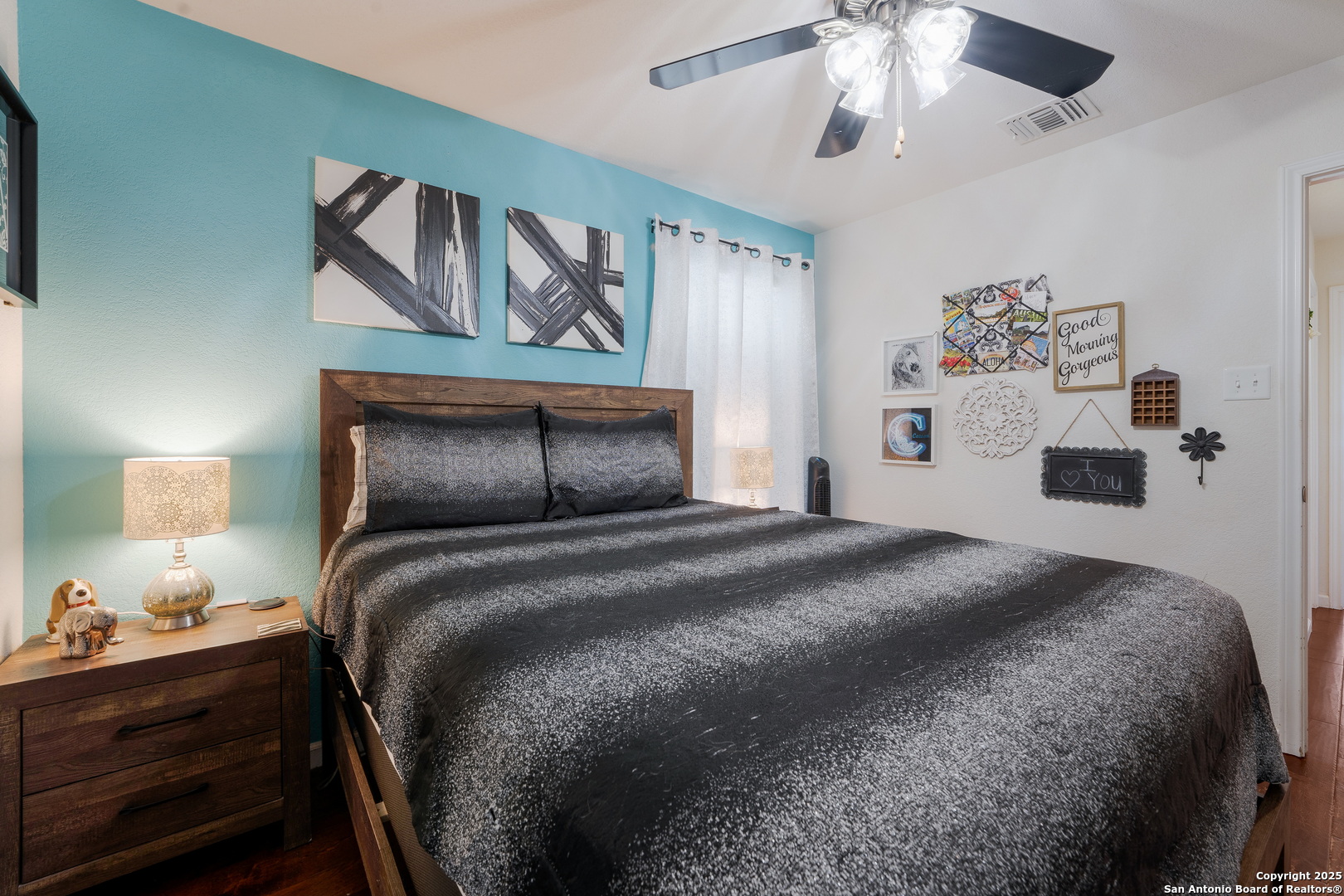 6226 Fred Couples Schertz, TX 78108 - Photo 23 of 30 a bedroom with a bed and a chandelier