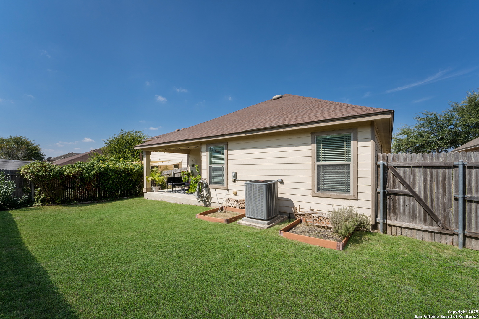 6226 Fred Couples Schertz, TX 78108 - Photo 28 of 30 a backyard of a house with table and chairs plants and large tree