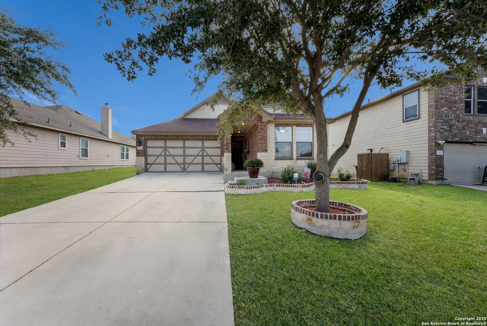6226 Fred Couples Schertz, TX 78108 - Photo 3 of 30 a front view of a house with a yard and tree