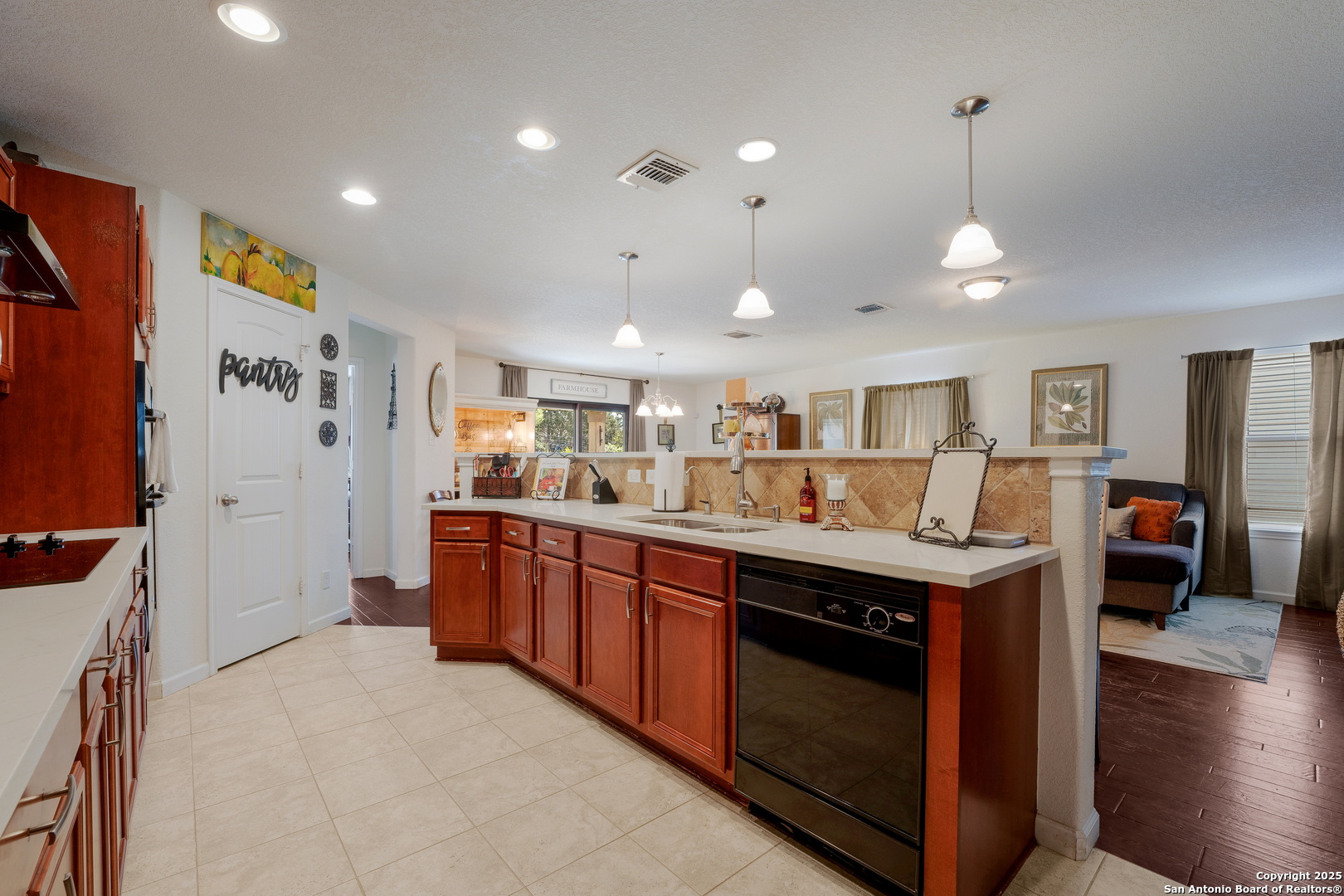 6226 Fred Couples Schertz, TX 78108 - Photo 6 of 30 a kitchen with stainless steel appliances granite countertop a sink and cabinets