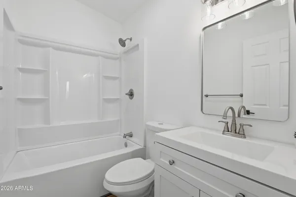 a bathroom with a sink a toilet and a bathtub