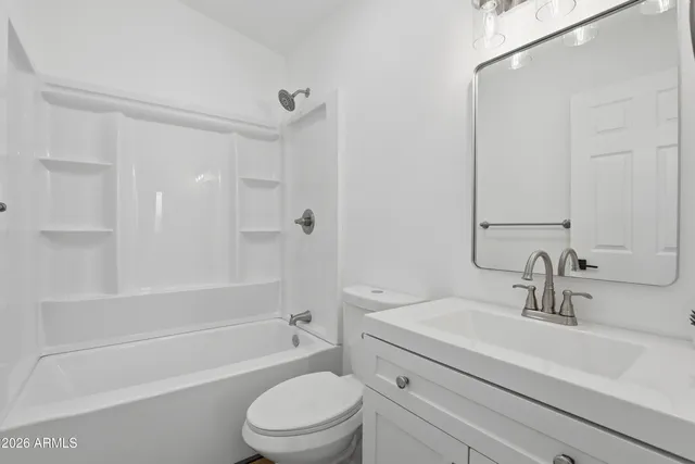 a bathroom with a sink a toilet and a bathtub