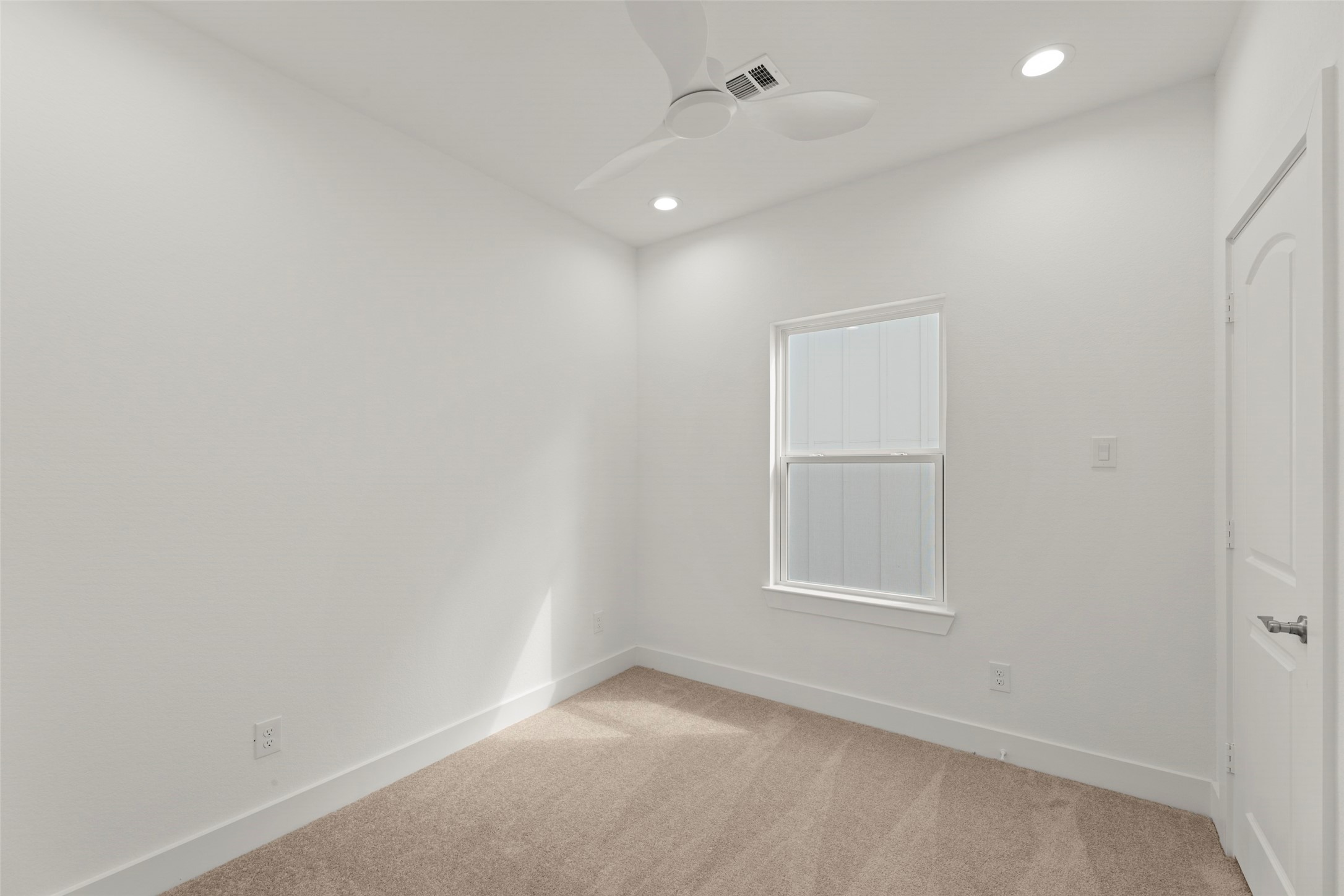 1477 Ferguson Way Houston, TX 77088 - Photo 11 of 37 an empty room with windows and closet