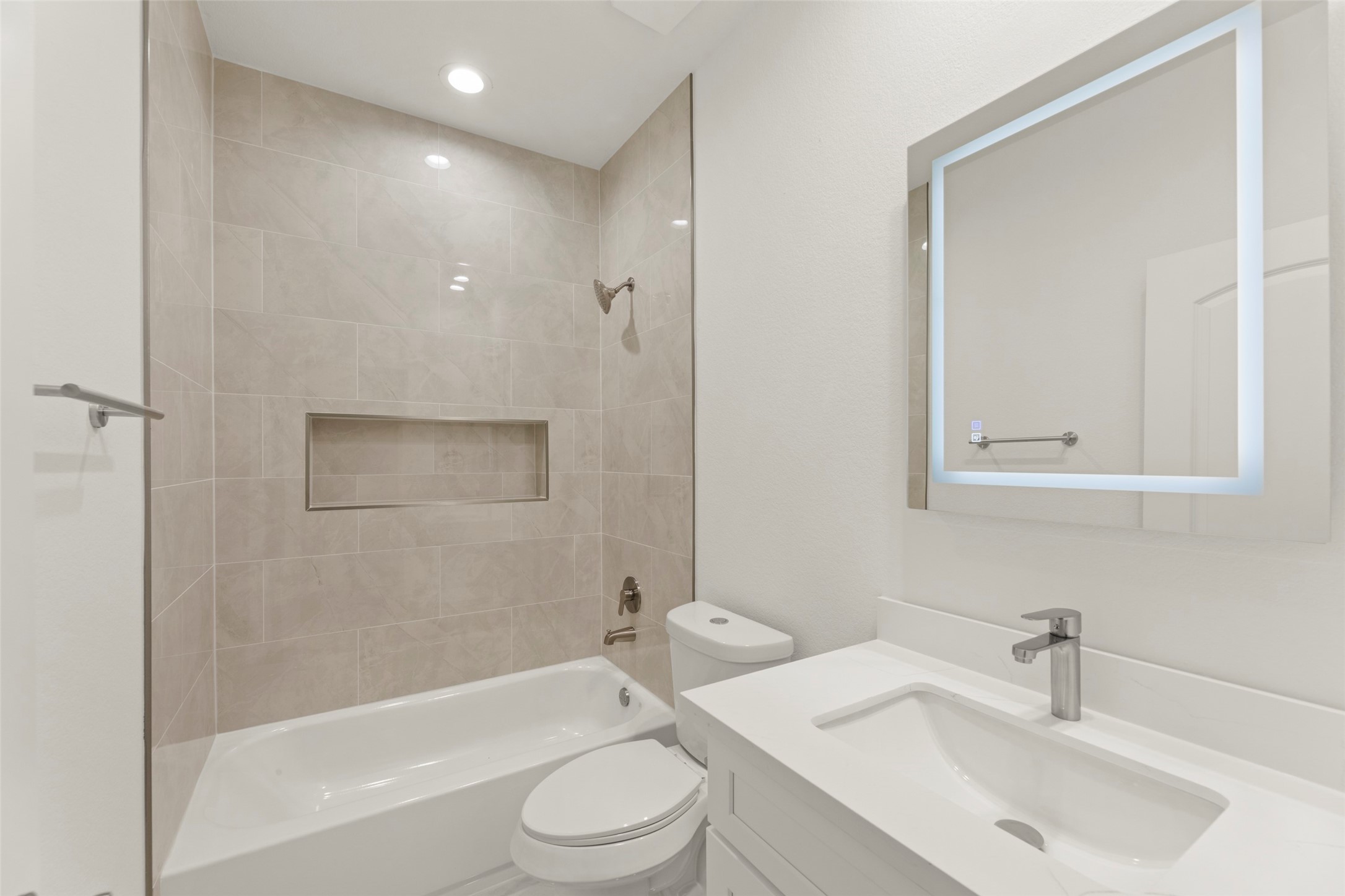 1477 Ferguson Way Houston, TX 77088 - Photo 13 of 37 a bathroom with a toilet a sink and bathtub