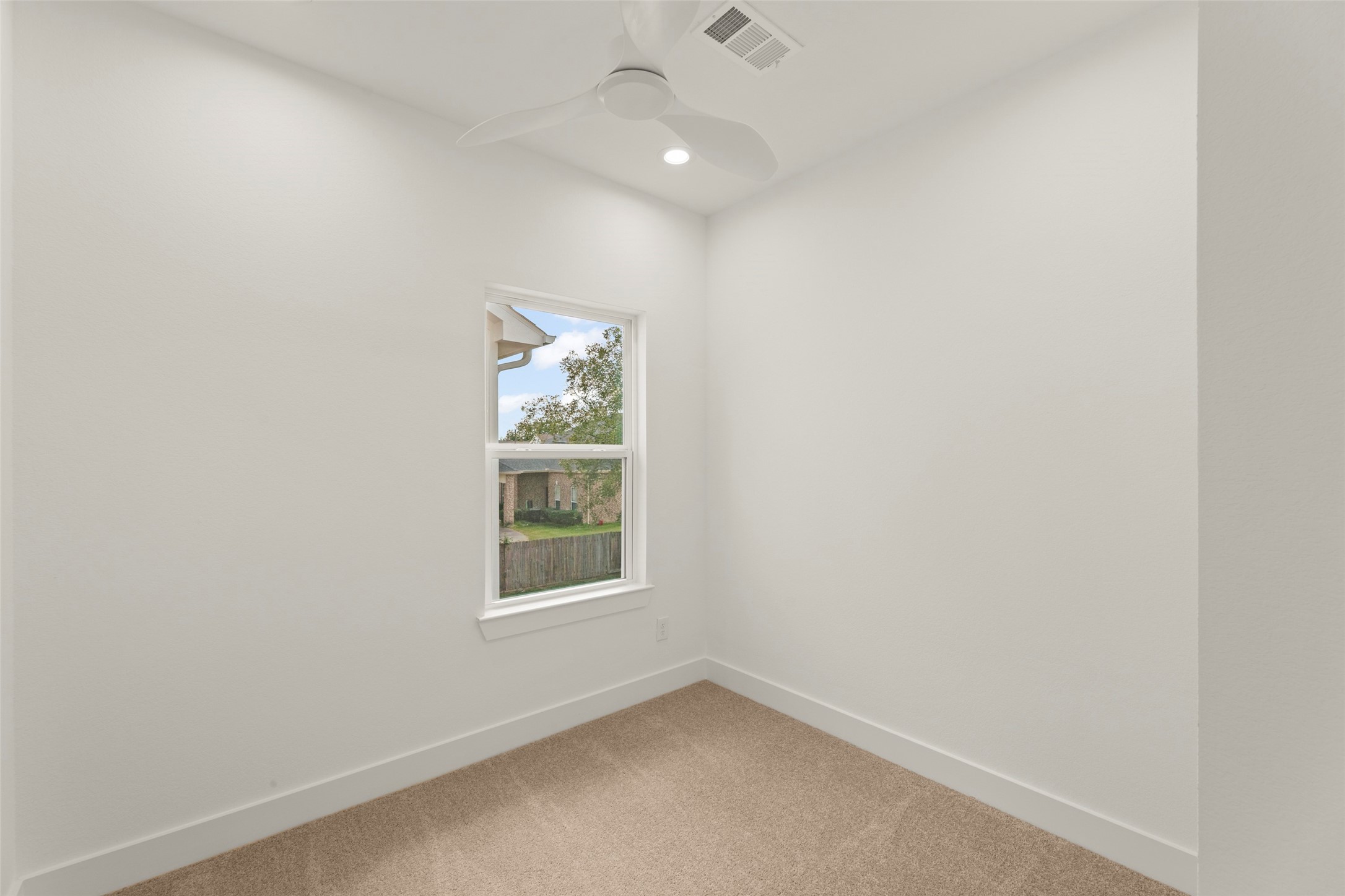 1477 Ferguson Way Houston, TX 77088 - Photo 14 of 37 an empty room with a window