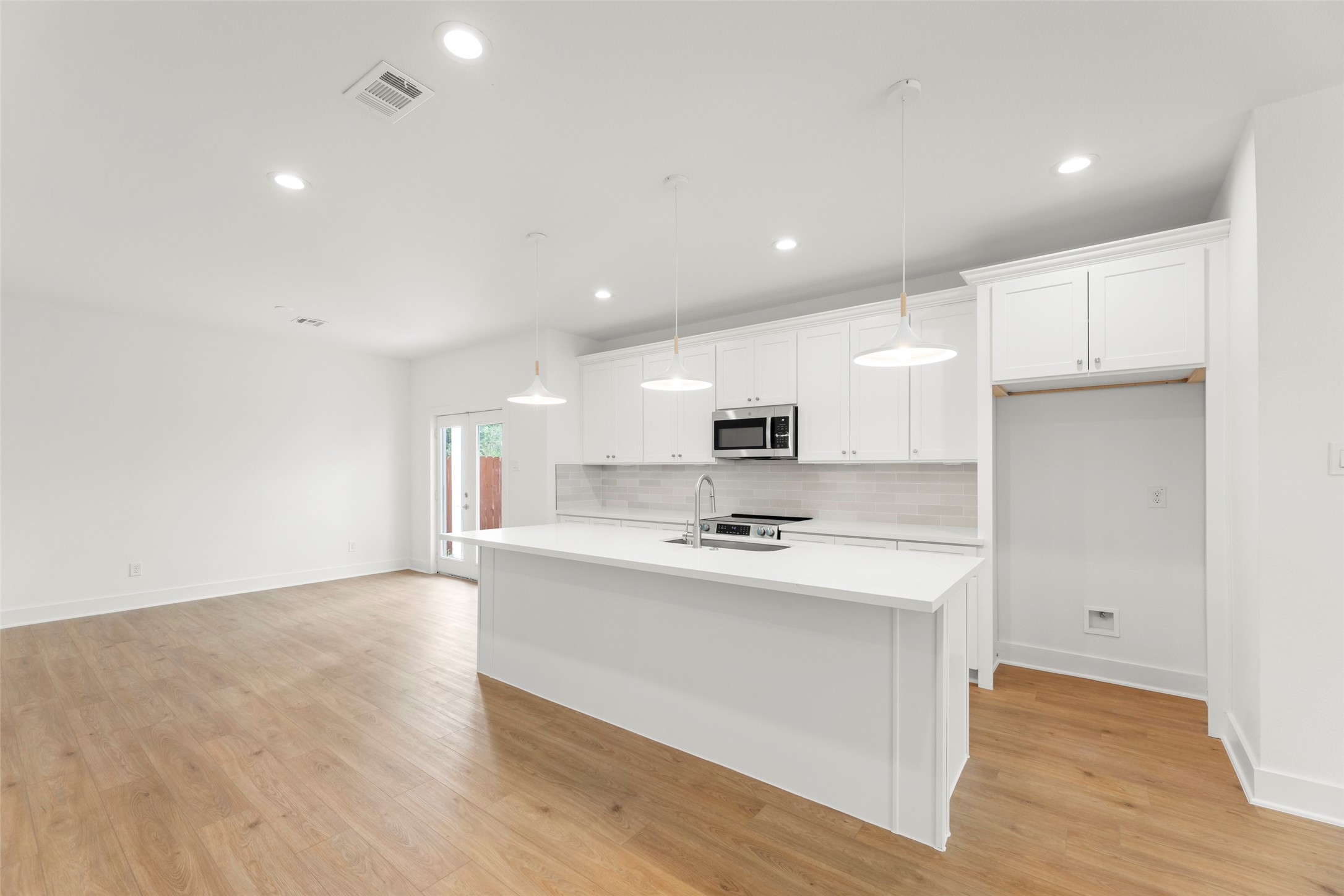 1477 Ferguson Way Houston, TX 77088 - Photo 20 of 37 a kitchen with stainless steel appliances a sink stove and refrigerator
