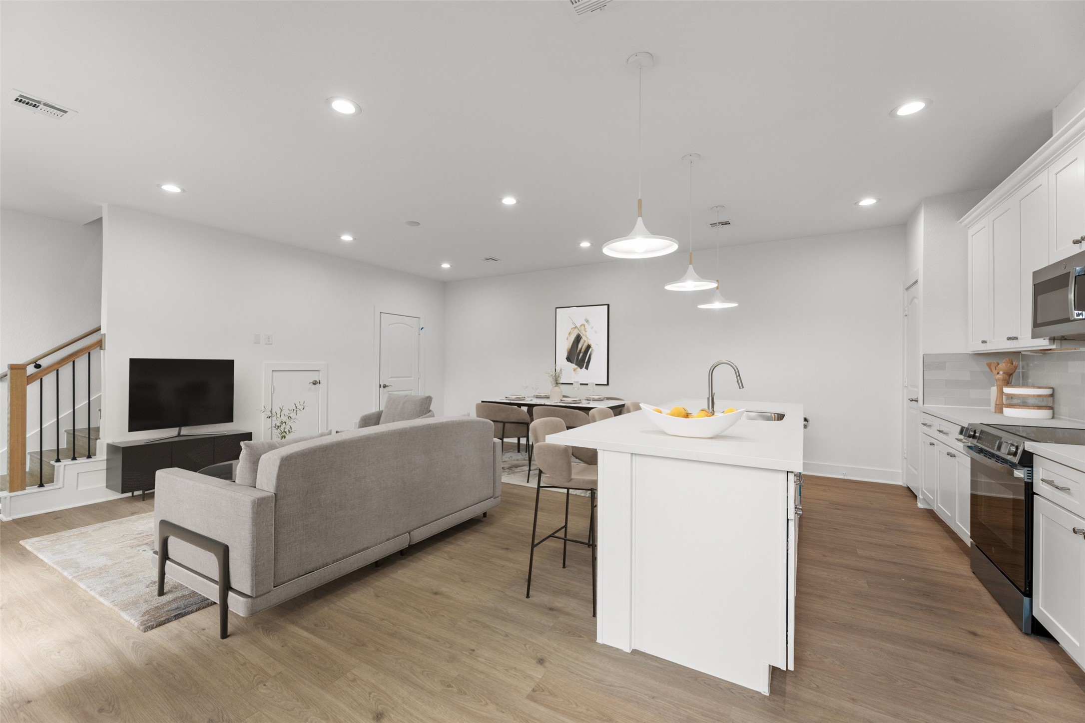 1477 Ferguson Way Houston, TX 77088 - Photo 2 of 37 a living room with stainless steel appliances furniture and a view of kitchen
