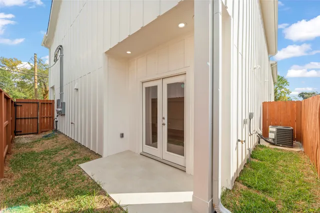 a view of a porch with wooden floor and a yard