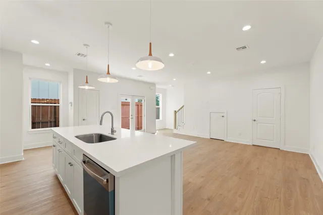 a kitchen with a sink and a refrigerator