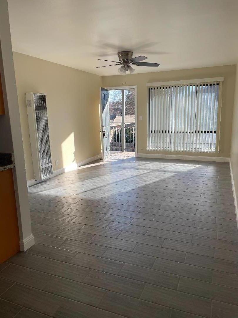 3786 Rolison Road Redwood City, CA 94063 - Photo 11 of 18 a view of an empty room with wooden floor and a window