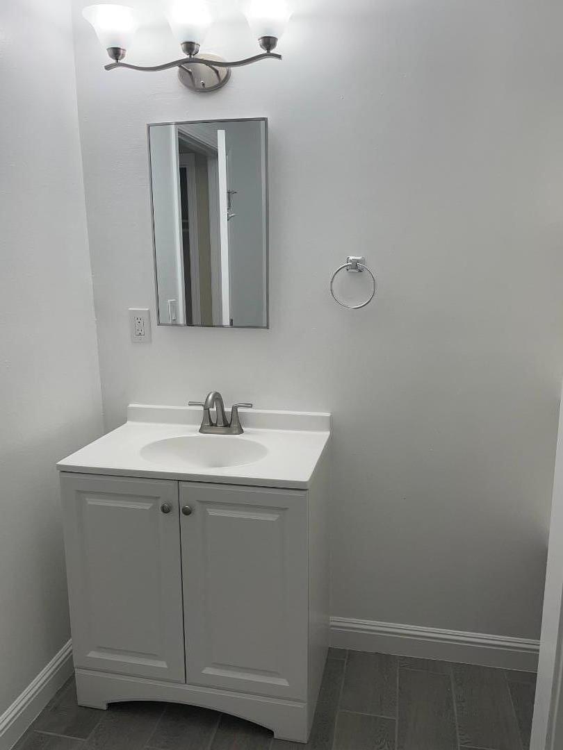3786 Rolison Road Redwood City, CA 94063 - Photo 12 of 18 a bathroom with a sink and a mirror
