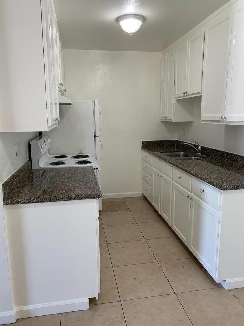 3786 Rolison Road Redwood City, CA 94063 - Photo 17 of 18 a kitchen with granite countertop a sink and a stove