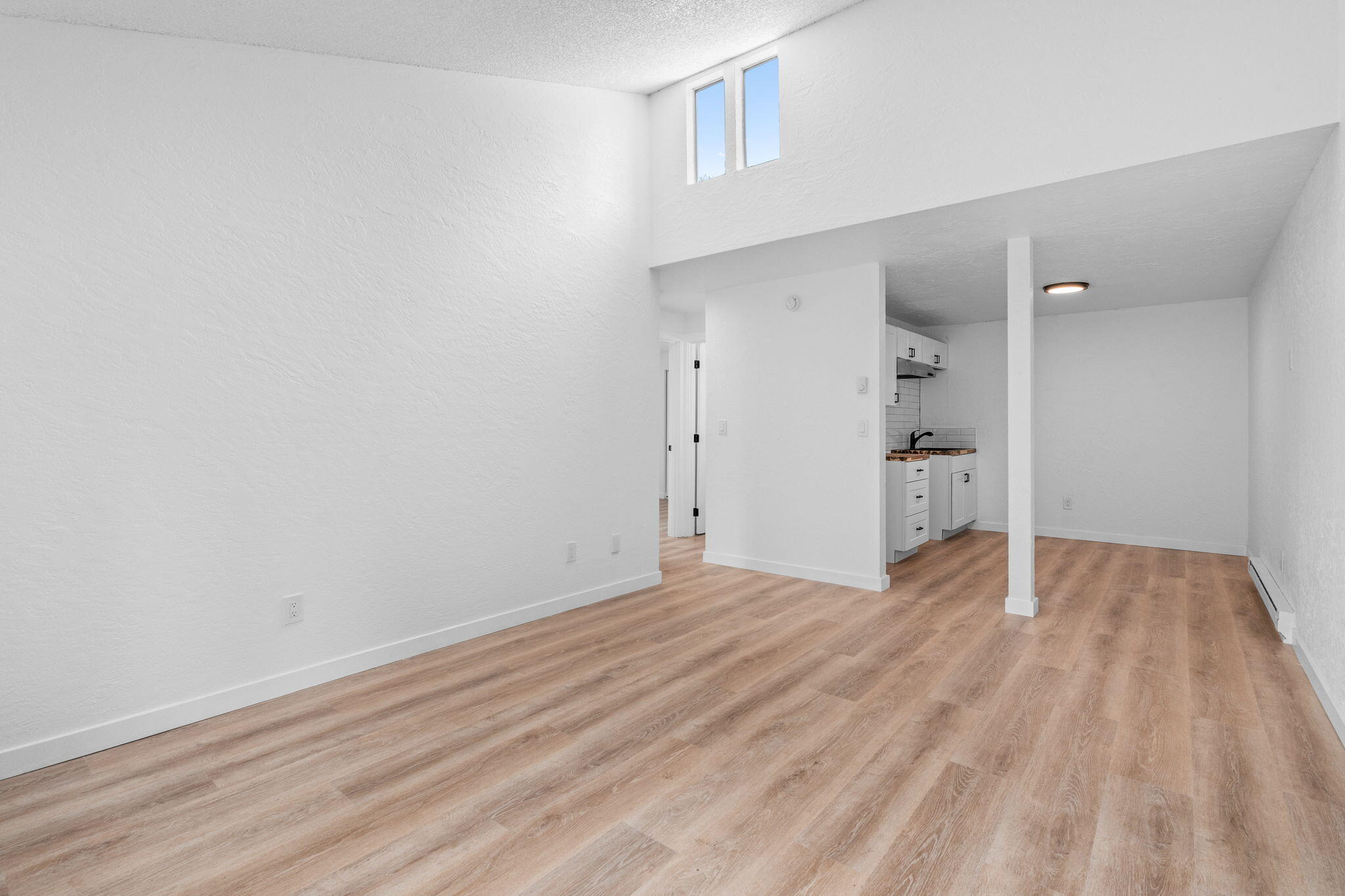 1700 Northeast Wells Acres Road, Unit 25 Bend, OR 97701 - Photo 8 of 25 a view of empty room with wooden floor