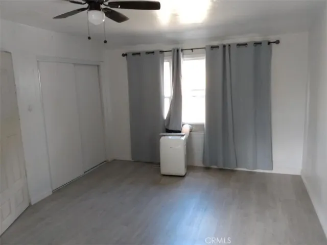 a view of a hallway with windows