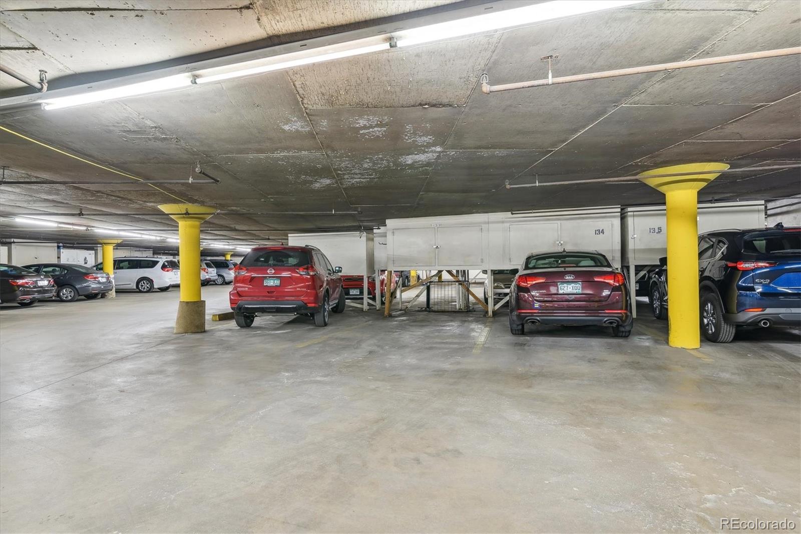 9655 Center Avenue, Unit 5A Denver, CO 80247 - Photo 2 of 45 a view of cars parked in a parking