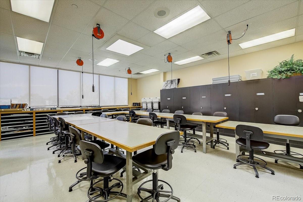 9655 Center Avenue, Unit 5A Denver, CO 80247 - Photo 22 of 45 a dinning table and chairs in a room